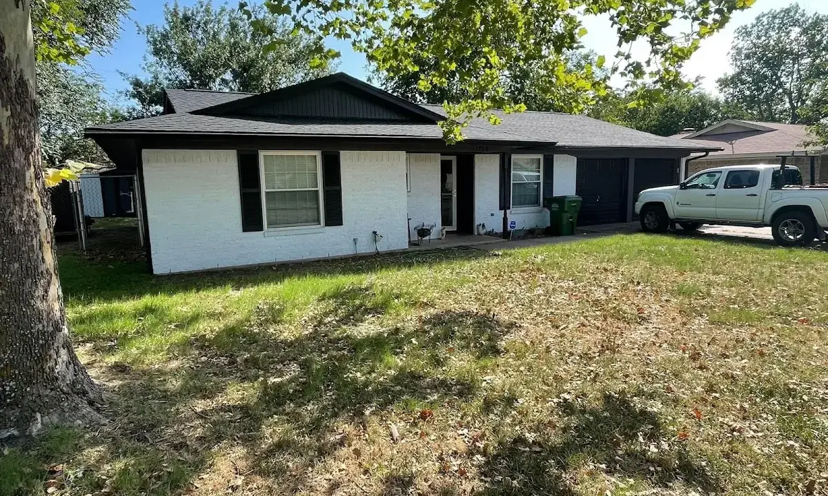 Professional roofing crew working on a residential roof in Watchung